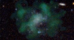 The galaxy AGC 114905. The stellar emission of the galaxy is shown in blue. The green clouds show the neutral hydrogen gas. The galaxy does not appear to contain any dark matter, even after 40 hours of detailed measurements with state-of-the-art telescopes. Credit: (c) Javier Román & Pavel Mancera Piña