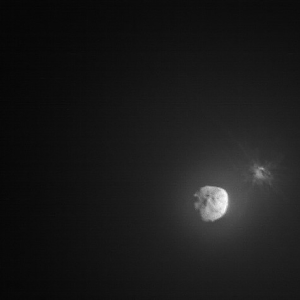 15 days before impact, the DART spacecraft deployed a small companion satellite to document its historic planetary defense technology demonstration. Provided by the Italian Space Agency, the Light Italian CubeSat for Imaging Asteroids, aka LICIACube, recorded this image of the event's aftermath. A cloud of ejecta is seen near the right edge of the frame captured only minutes following DART's impact with target asteroid Dimorphos while LICIACube was about 80 kilometers away. Presently about 11 million kilometers from Earth, 160 meter diameter Dimorphos is a moonlet orbiting 780 meter diameter asteroid Didymos. Didymos is seen off center in the LICIACube image.