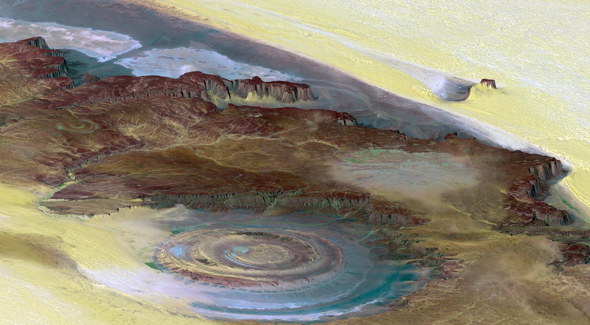 Richat Structure: A topographic reconstruction scaled 6 to1 on the vertical axis from satellite photos. False colouring as follows: Brown bedrock, Yellow or white sand, Green vegetation, Blue salty sediments