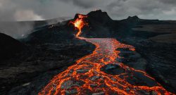 A Volcanic Eruption with lava flowing down from the mountain. By Tetiana Grypachevska on Unsplash